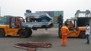 Forklift is loading electric trolleys